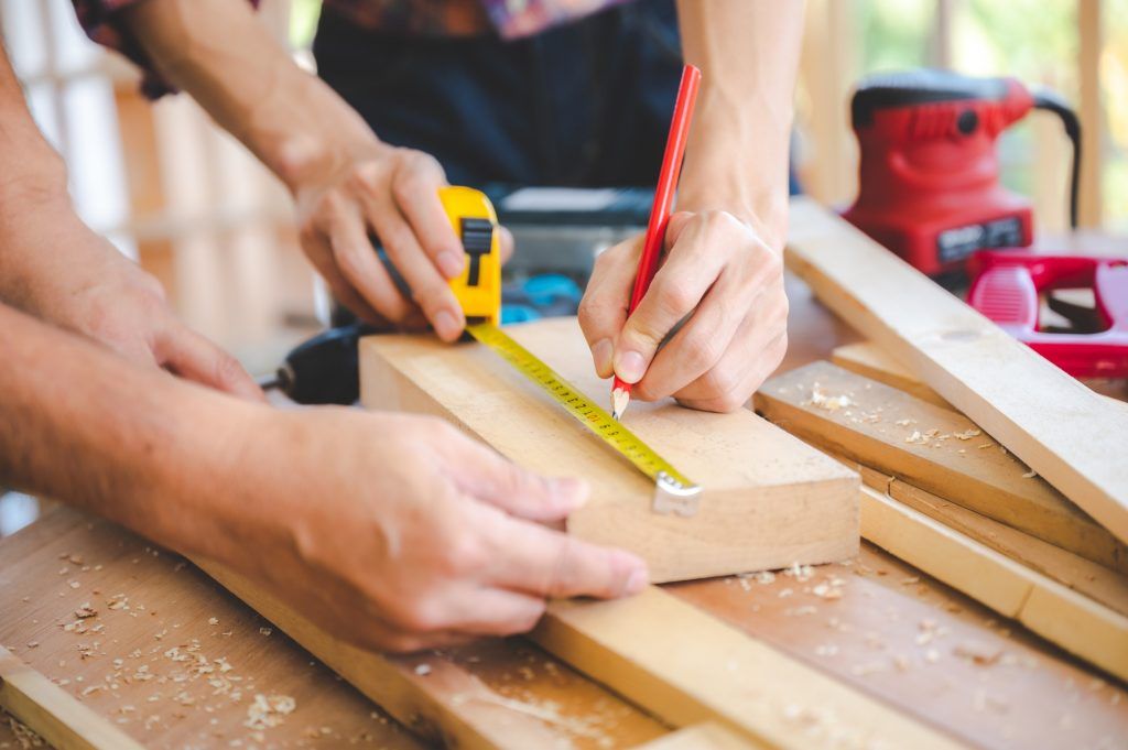 wooden workshop concept, carpenter team craftsman person working with a wood work construction tool